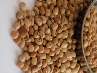 Pile and heap of a dried Red color Organic Cow Pea or Alsande Kalu in a white background.