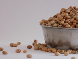 Pile and heap of a dried Red color Organic Cow Pea or Alsande Kalu in a white background.