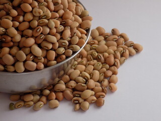 Pile and heap of a dried Red color Organic Cow Pea or Alsande Kalu in a white background.