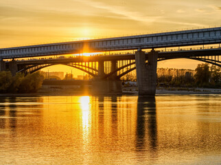 Bridges across the Ob in Novosibirsk in the golden light of sunset.