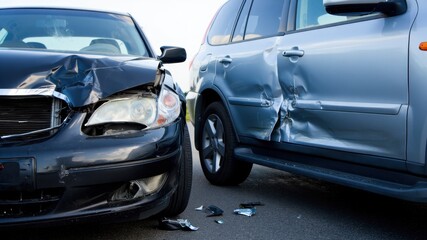 Car accident on road, damaged vehicles after collision, traffic incident, vehicle crash aftermath, road safety issue, insurance case, accident investigation, urban traffic accident