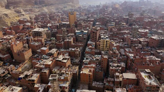 Trash-Cluttered Houses And Piles Of Garbage At Garbage City (Manshiyat Naser) In Cairo, Egypt. aerial shot