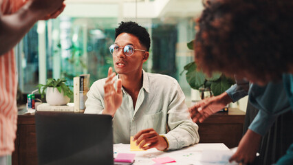Collaboration, conversation or meeting with business people in office for ideas, planning or proposal. Listening, pitch or talking with employee team at laptop for discussion, strategy or sticky note