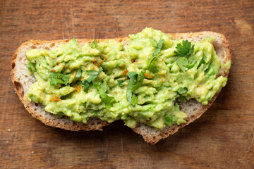 Whole grain toast with avocado, cilantro and spices