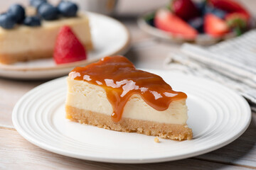 Cheesecake with salted caramel sauce topping, closeup view