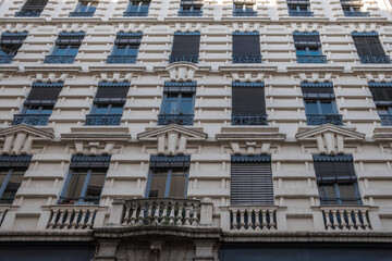 Vintage multi-story building with architectual detail during the day