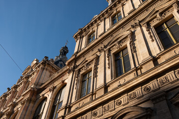 Looking up at an angle of Palais de la Bourse de Lyon on clear day
