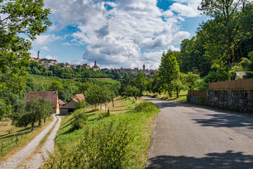 View of the romantic skyline of Rothenburg ob der Tauber at a hike through the idyllic Tauber Valley