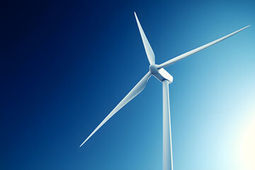 A wind turbine rotates efficiently against a bright blue sky, promoting clean energy production
