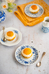 Lemon cupcakes with cream cheese, apricot and poppy seed. Cupcake in form of Fried Egg on a stone background. Easter eggs. Easter holiday and festive food.