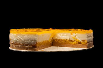 Orange cheesecake isolated on a white background.
