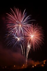 Red, white, and blue fireworks create a dazzling American flag motif against the backdrop of a clear night sky - pattern seamless abstract