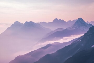 Fototapeta premium Pastel mountain range sunrise view over clouds