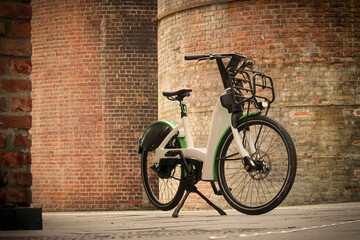 electric bicycle in front of brick building