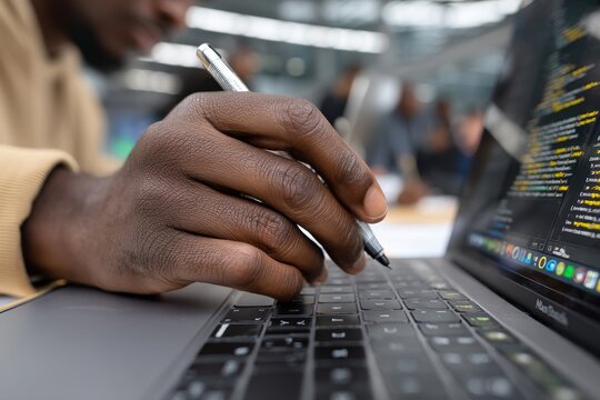 Two data science specialists are working together in an office, analyzing big data on their screens as they collaborate on a new project