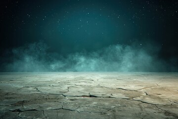Cracked desert landscape under a starry night sky with mist hovering in the background