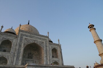 Taj Mahal at sunset. View of Taj Mahal against blue sky background.