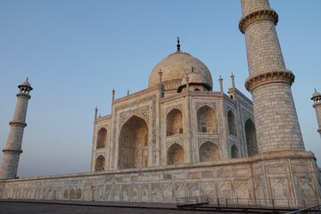 Taj Mahal at sunset. View of Taj Mahal against blue sky background.
