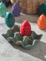 Traditional Maslenitsa: an egg-shaped candle with a willow twig. Selective focus
