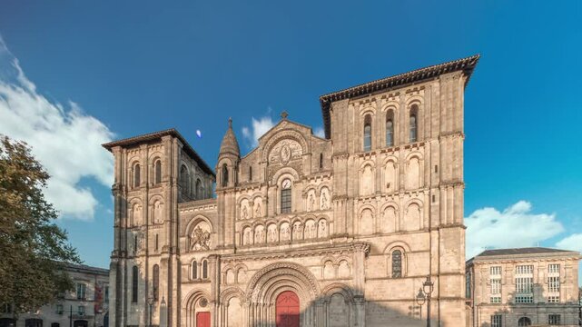 Eglise Abbatiale Sainte-Croix timelapse hyperlapse in Bordeaux, France, Romanesque Catholic church with a medieval facade. Landmark showcases rich architectural and cultural heritage under a blue sky