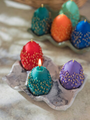 Traditional Maslenitsa: an egg-shaped candle with a willow twig. Selective focus
