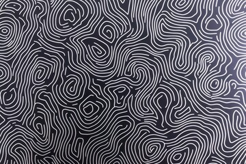 Fototapeta premium An abstract pattern of white lines creating wavy, organic shapes on a dark background, evoking a sense of movement and depth.