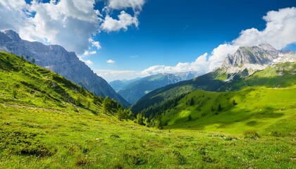 majestic alpine landscape featuring lush green mountains under bright blue sky and soft white clouds on a sunny day