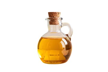 A photo of a clear glass bottle filled with golden oil