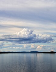 Fototapeta premium Serene lake landscape with dramatic clouds