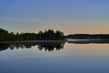 Fototapeta premium Serene lake landscape at dawn