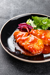 Fish tomato sauce whitefish fillet appetizer dish organic fresh tasty gourmet food background on the table rustic food top view copy space keto paleo diet vegetarian food pescetarian diet
