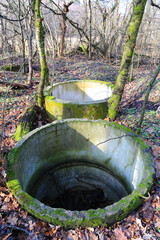 abandoned drainage wells in forest