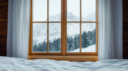 Fototapeta premium Sleep hygiene Concept. Cozy winter view through a window with snowy mountains outside.