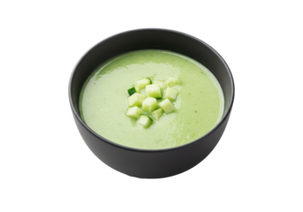 Creamy green soup with diced cucumber served in a black bowl, minimalistic style