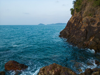 Aerial view exotic tropical island sea beach wave mountain green forest rocky stone