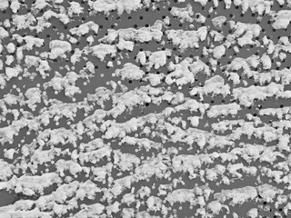 Perforated wall covered with snow texture background