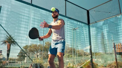 Padel tennis, serve and sports with man on court for competition, training and performance. Game, health workout and fitness club with person in match for athlete, exercise and racket tournament