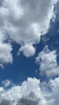 Timelapse motion of rolling clouds in a clear daytime sky