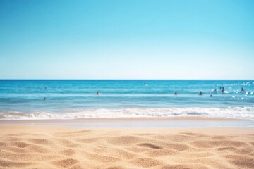 warm tranquil beach scene signals start of summer with blurred figures of people in background