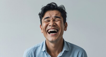 Indonesian 40s man on white plain bright background happy laughing hysterical looking at camera portrait banner with copy space ad concept marketing