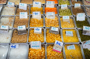 Red and yellow lentils for sale on a spice market in Mumbai, India, fresh ingredients for cooking...