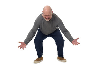 front view of a man lifting something heavy from the ground on white background