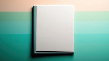 Elegant White Book Resting on Vibrant Green and Orange Backgrounds