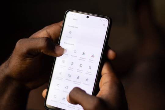 Lugbe, Abuja-Nigeria - April 22nd 2024: african person using opay mobile app