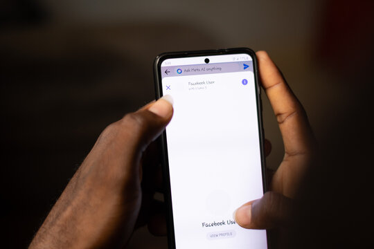 Lugbe, Abuja-Nigeria - April 22nd 2024: african person using meta ai on facebook