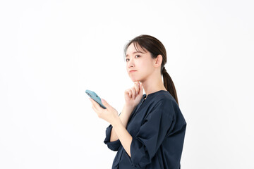 Fototapeta premium スマホ・悩む女性