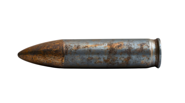 Vintage Rusty Bullet on White Surface for Eerie Firearms Themes in Photography