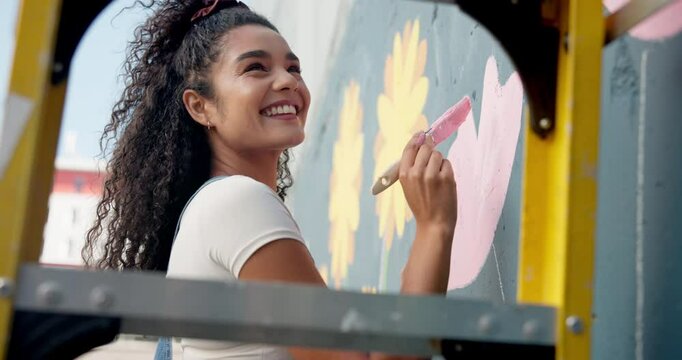 Ladder, woman and painting mural on wall for creative design, flower decor or volunteer. Artist, happy painter and outdoor with brush for environment activist, inspiration or sustainable art in city