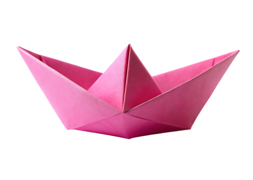 Pink paper boat folded by hand, isolated on white for craft, child play, or imagination themes.