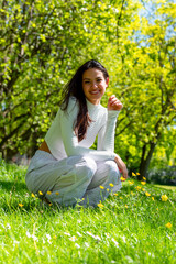 Smiling woman enjoying nature on a sunny day of spring in a public park in Stuttgart, Germany